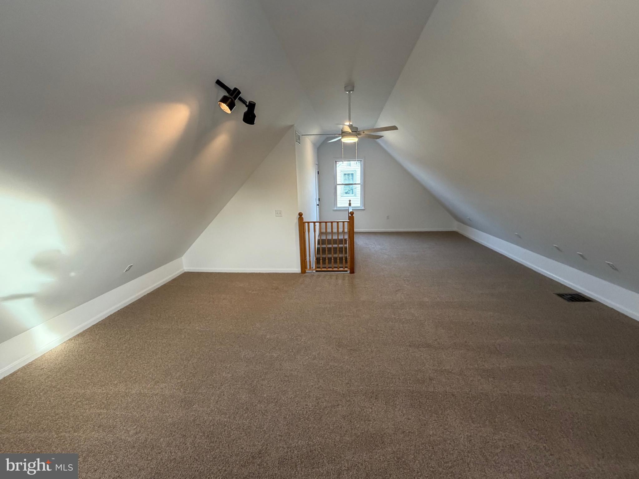 972 South Little Creek Road Dover, DE 19901 - Photo 16 of 22 an empty room with stairs and windows