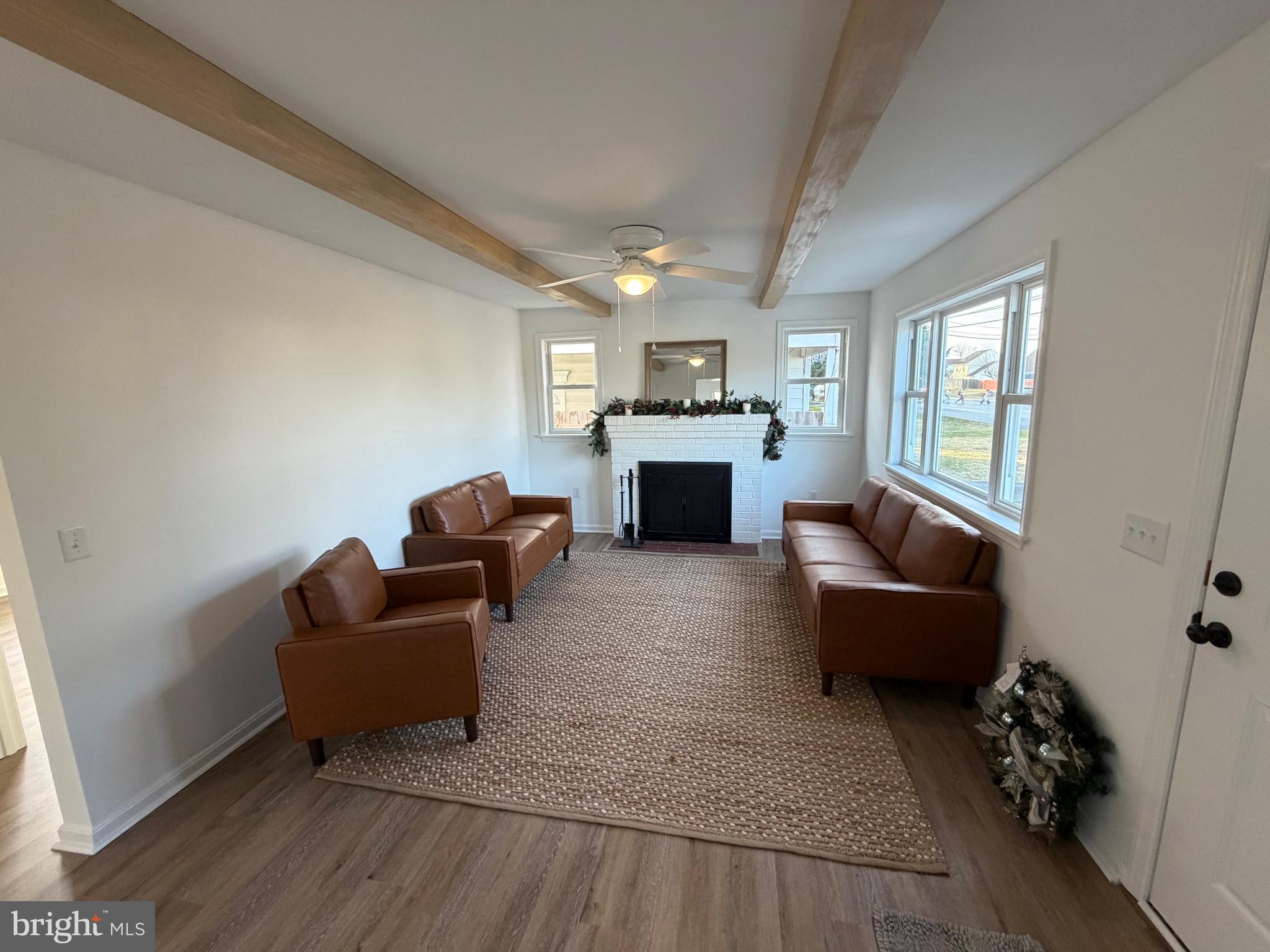 972 South Little Creek Road Dover, DE 19901 - Photo 6 of 22 a living room with furniture and a fireplace