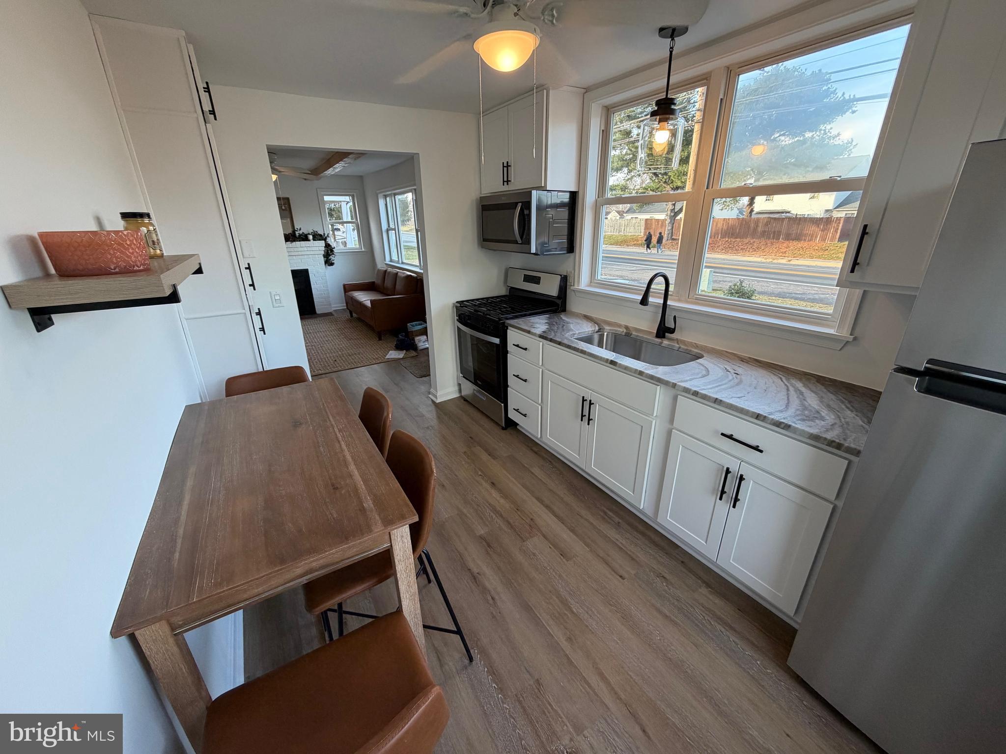 972 South Little Creek Road Dover, DE 19901 - Photo 8 of 22 a living room with furniture and a window