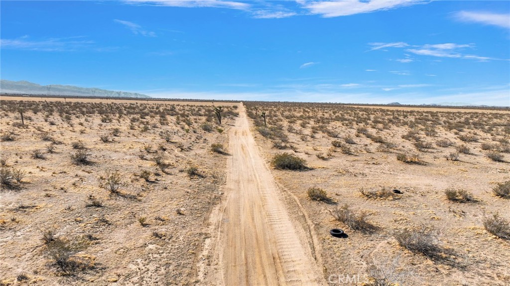 0 Trinidad Road Adelanto, CA 92301 - Photo 14 of 14 a view of a dry yard with wooden fence