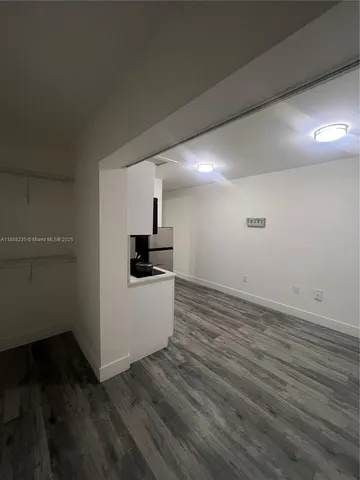 a view of kitchen and wooden floor