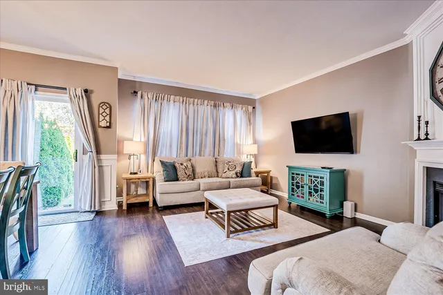 a bedroom with furniture and a flat screen tv