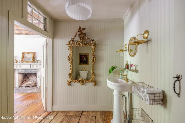 a view of a workspace with furniture and window