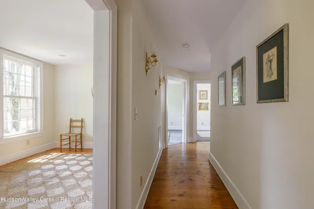 a view of a livingroom with wooden floor and a window