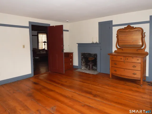 a view of a livingroom with wooden floor