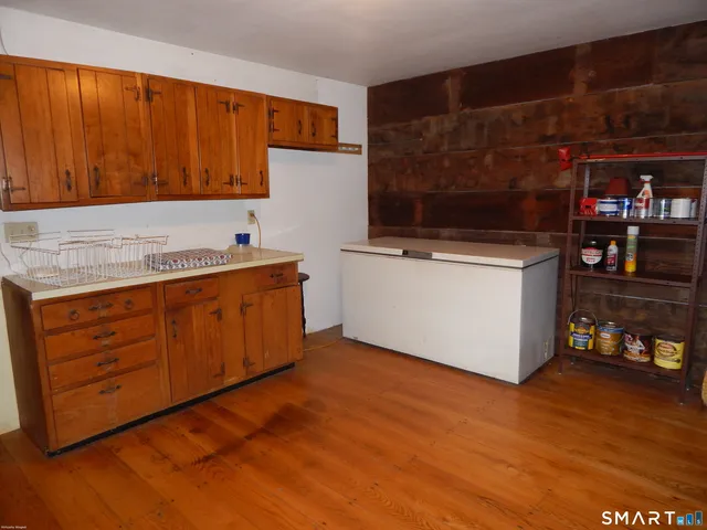 a kitchen with stainless steel appliances granite countertop a sink and a cabinets