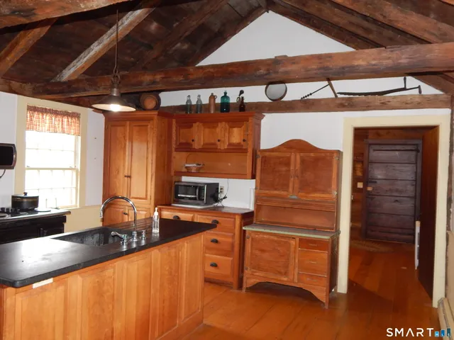 a kitchen with sink and window