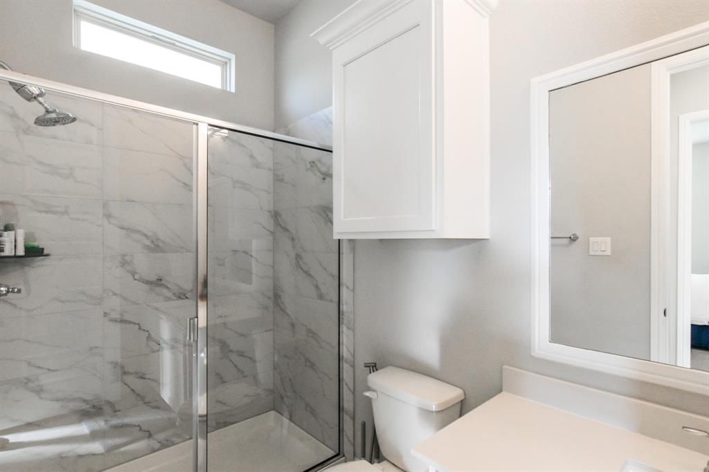 2516 Maidenhair Road Frisco, TX 75033 - Photo 22 of 30 a bathroom with a toilet and a shower