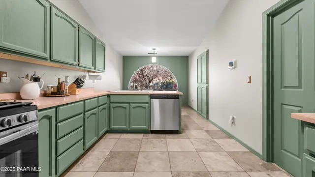 a bathroom with a double vanity sink mirror and a bathtub