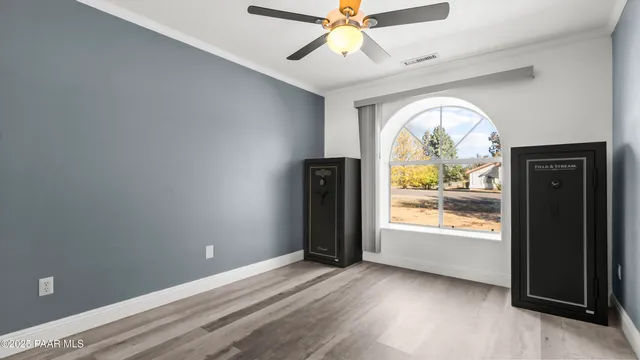 a front view of a house with a yard covered in snow