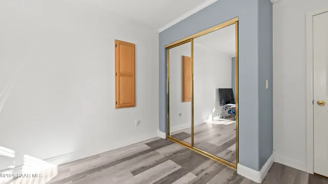 an aerial view of a house with a yard and garden