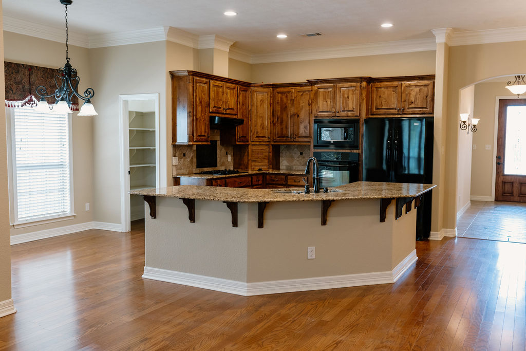 1909 Debbie Drive Bryan, TX 77802 - Photo 11 of 34 a view of kitchen with stainless steel appliances kitchen island