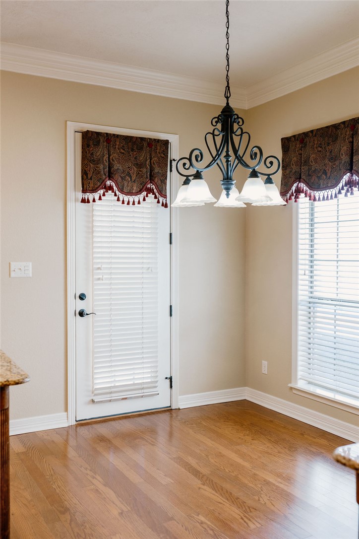 1909 Debbie Drive Bryan, TX 77802 - Photo 14 of 34 a view of a big room with wooden floor and windows