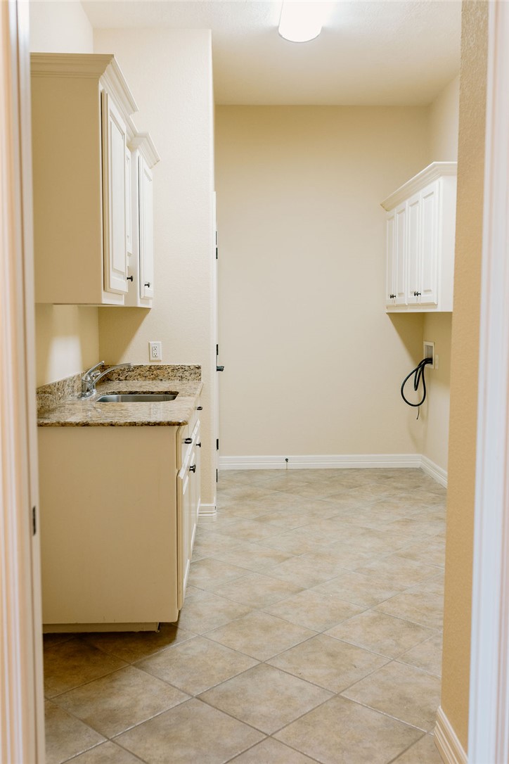 1909 Debbie Drive Bryan, TX 77802 - Photo 15 of 34 a view of a storage & utility room with a sink