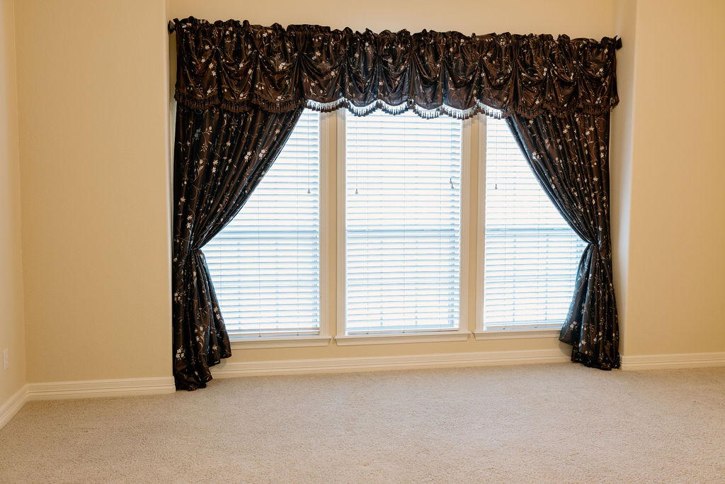 1909 Debbie Drive Bryan, TX 77802 - Photo 23 of 34 an empty room with windows