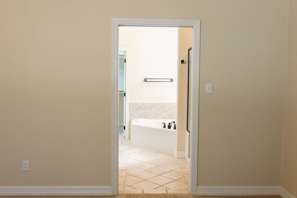 1909 Debbie Drive Bryan, TX 77802 - Photo 25 of 34 a view of a bathroom from a hallway