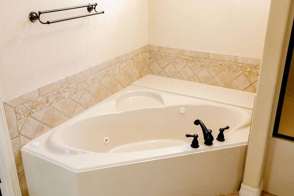 1909 Debbie Drive Bryan, TX 77802 - Photo 28 of 34 a bathroom with a bathtub