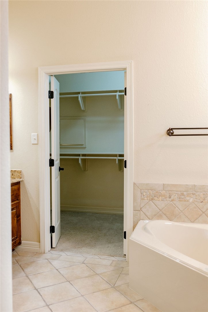 1909 Debbie Drive Bryan, TX 77802 - Photo 29 of 34 a bathroom with a bathtub