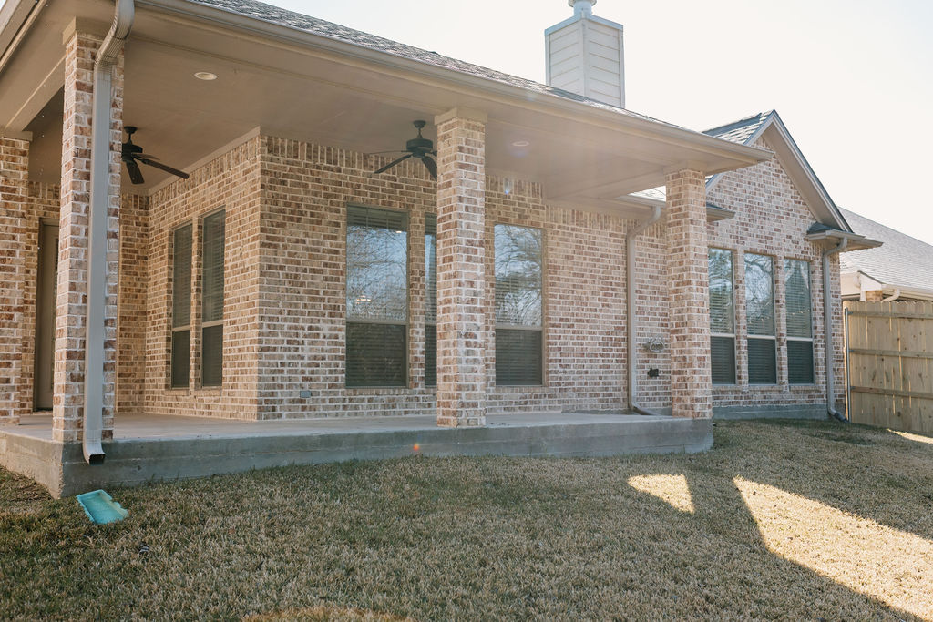1909 Debbie Drive Bryan, TX 77802 - Photo 34 of 34 a view of a brick house with large windows