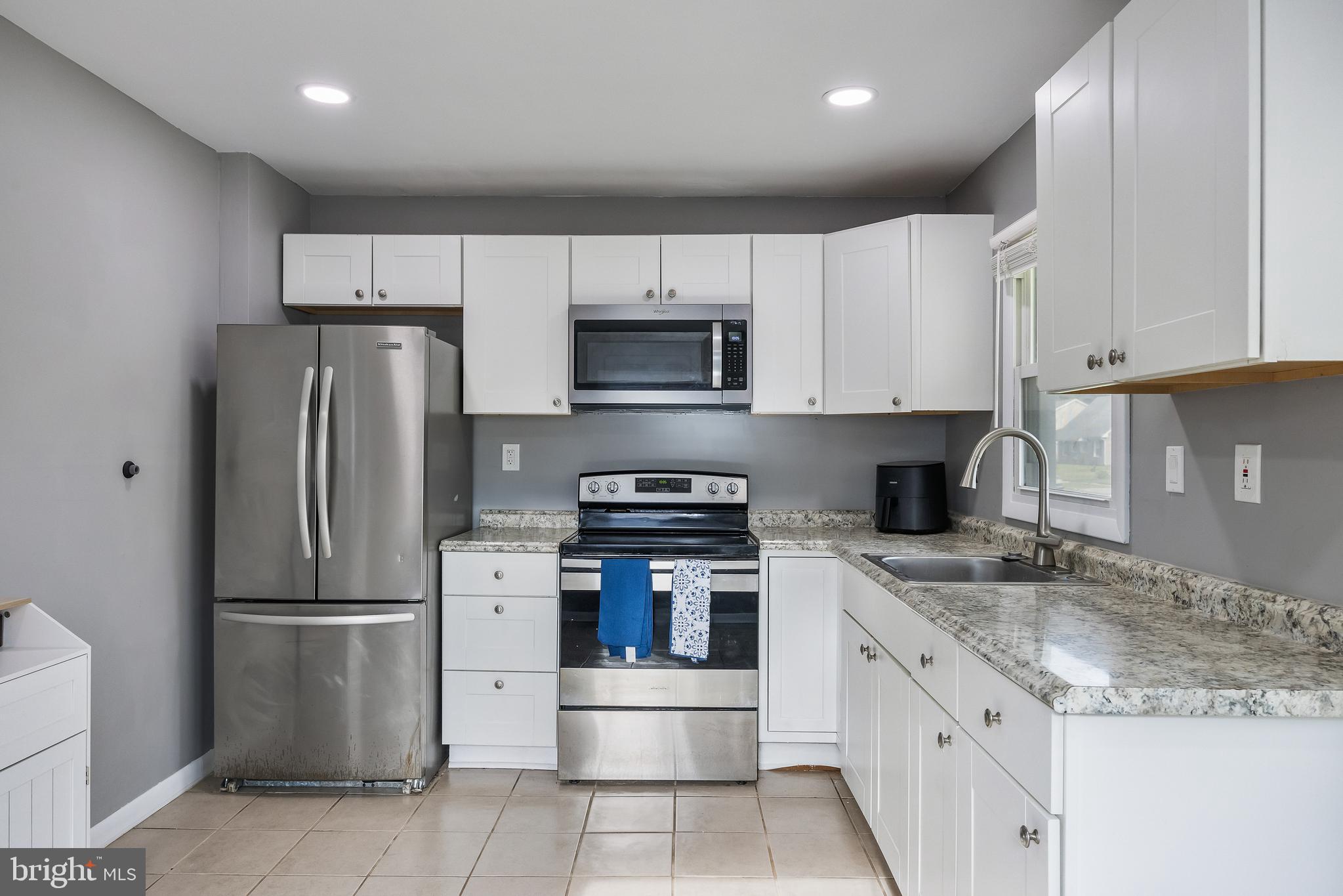 30 Babcock Lane Willingboro, NJ 08046 - Photo 8 of 35 a kitchen with stainless steel appliances granite countertop a refrigerator sink and stove