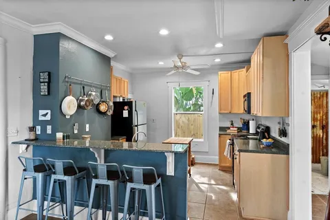 a kitchen with a table and chairs in it