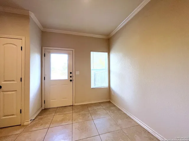 a view of an empty room and window