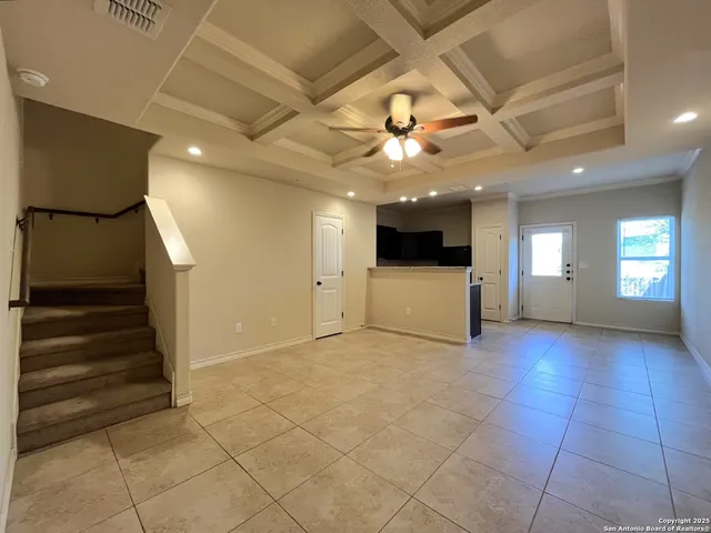 a view of entryway and hall with a workspace