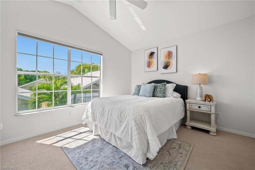 1590 Weybridge Circle, Unit 52 Naples, FL 34110 - Photo 21 of 36 a bedroom with a bed and window