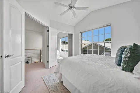 a bedroom with a bed and a walk in closet