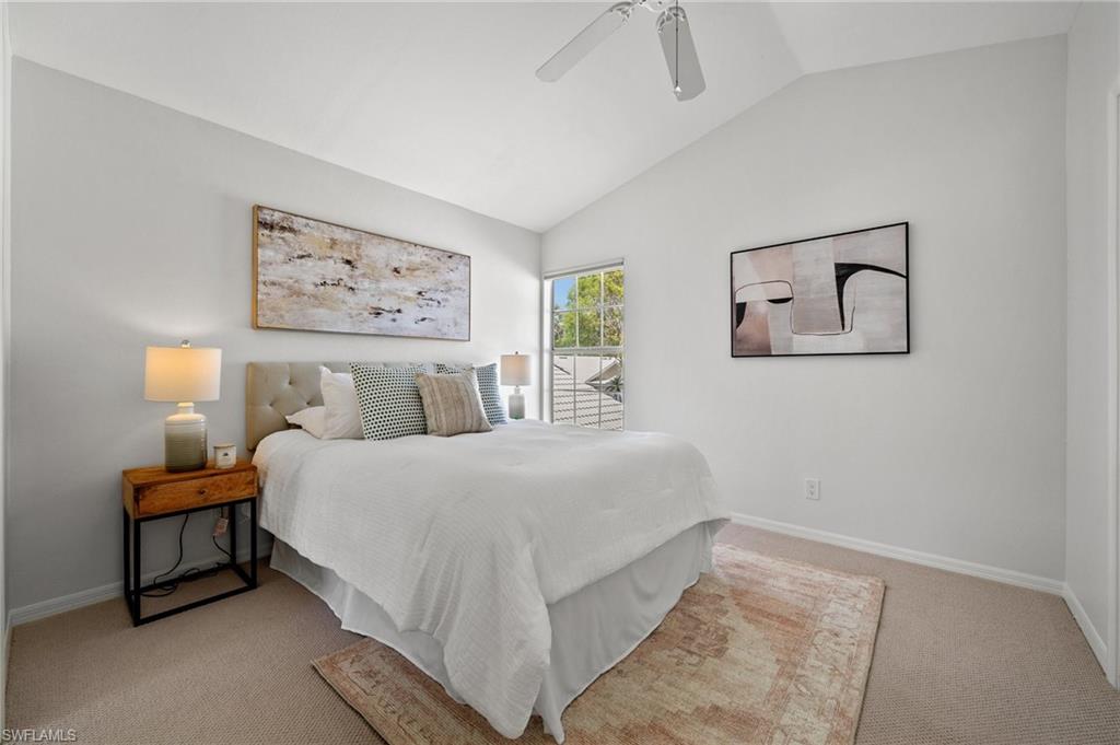 1590 Weybridge Circle, Unit 52 Naples, FL 34110 - Photo 25 of 36 a bedroom with bed and painting on the wall