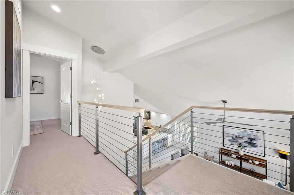 1590 Weybridge Circle, Unit 52 Naples, FL 34110 - Photo 27 of 36 a view of a livingroom with hardwood