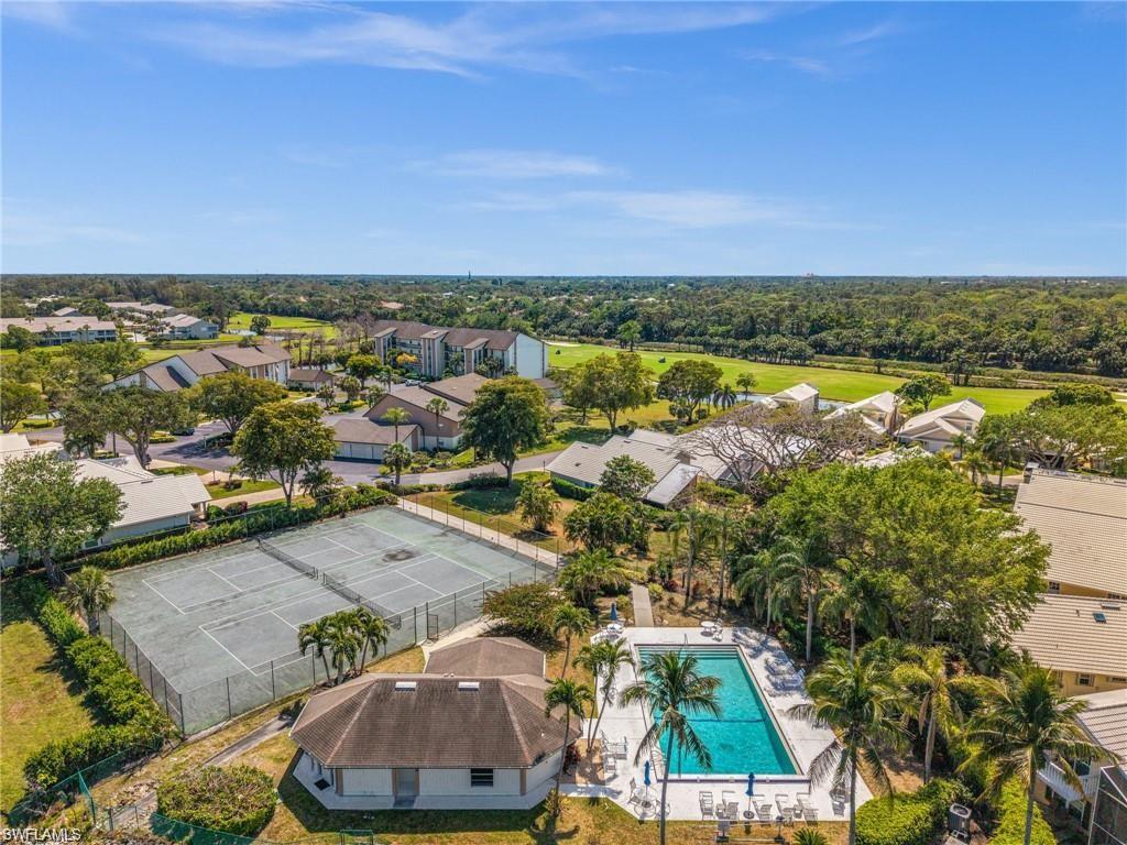 1590 Weybridge Circle, Unit 52 Naples, FL 34110 - Photo 36 of 36 an aerial view of residential houses with outdoor space