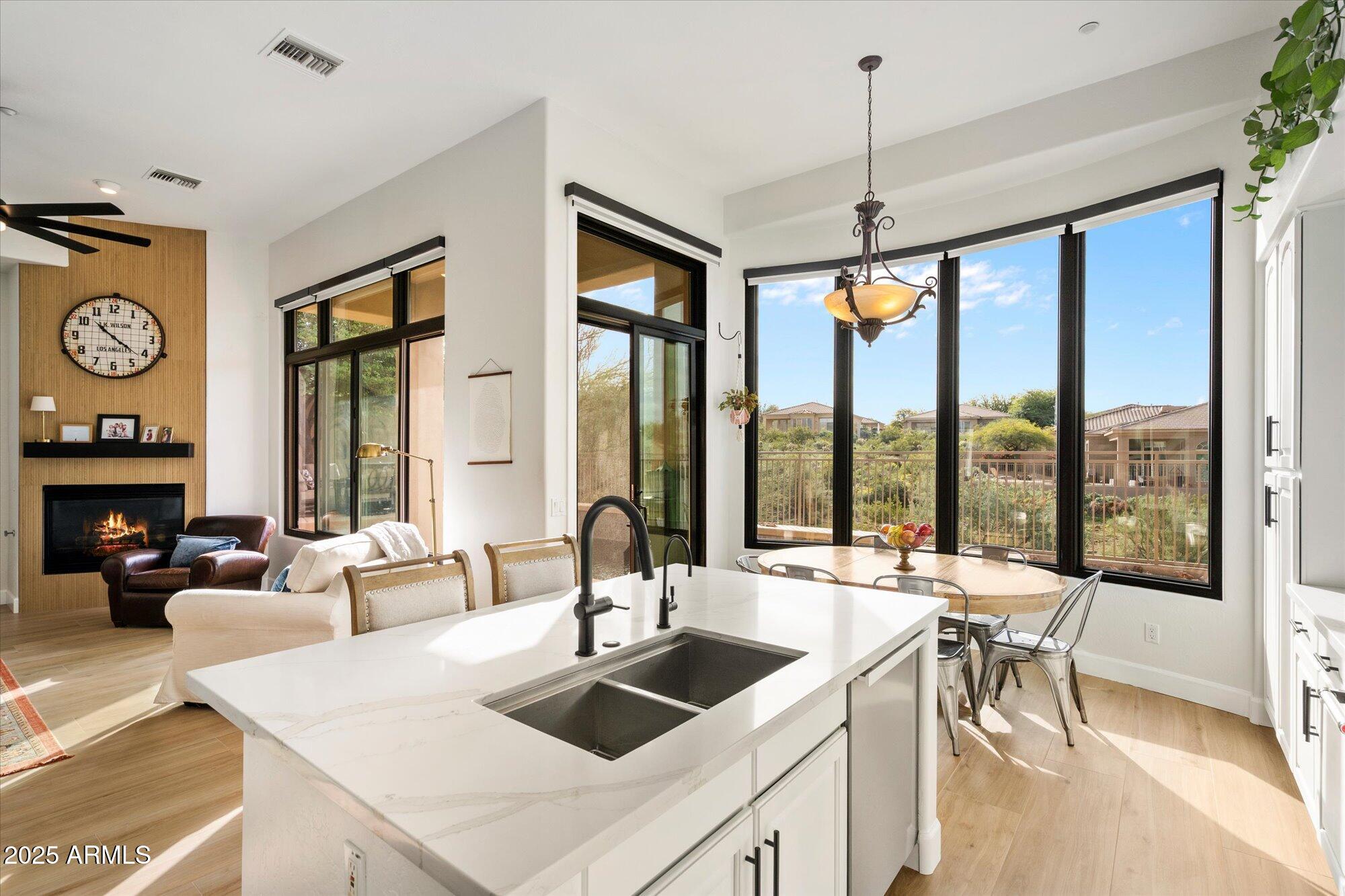 10747 East Greenway Road Scottsdale, AZ 85255 - Photo 1 of 56 a view of a kitchen with a large window and living room