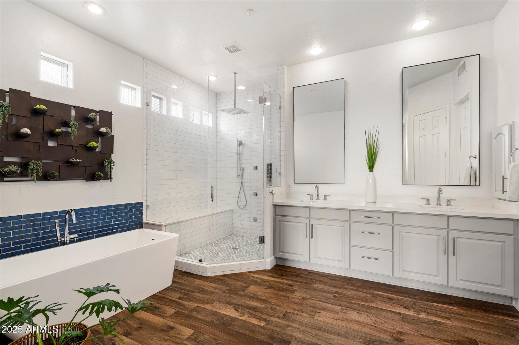 10747 East Greenway Road Scottsdale, AZ 85255 - Photo 19 of 56 a bathroom with a tub sink and mirror