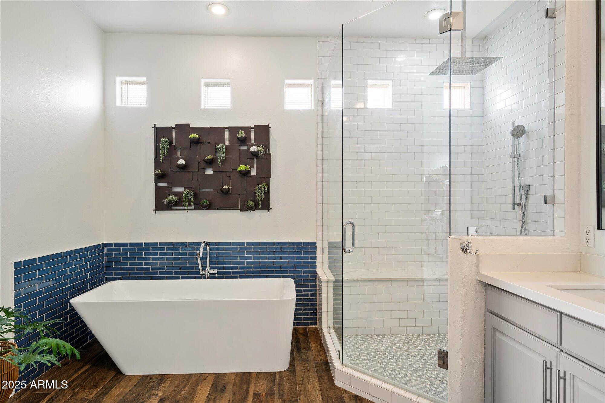 10747 East Greenway Road Scottsdale, AZ 85255 - Photo 20 of 56 a bathroom with a sink a mirror and shower