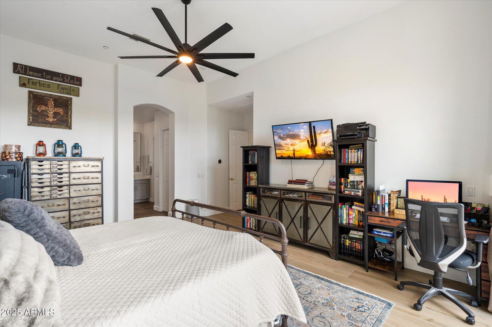 10747 East Greenway Road Scottsdale, AZ 85255 - Photo 23 of 56 a bedroom with a bed a desk and chair