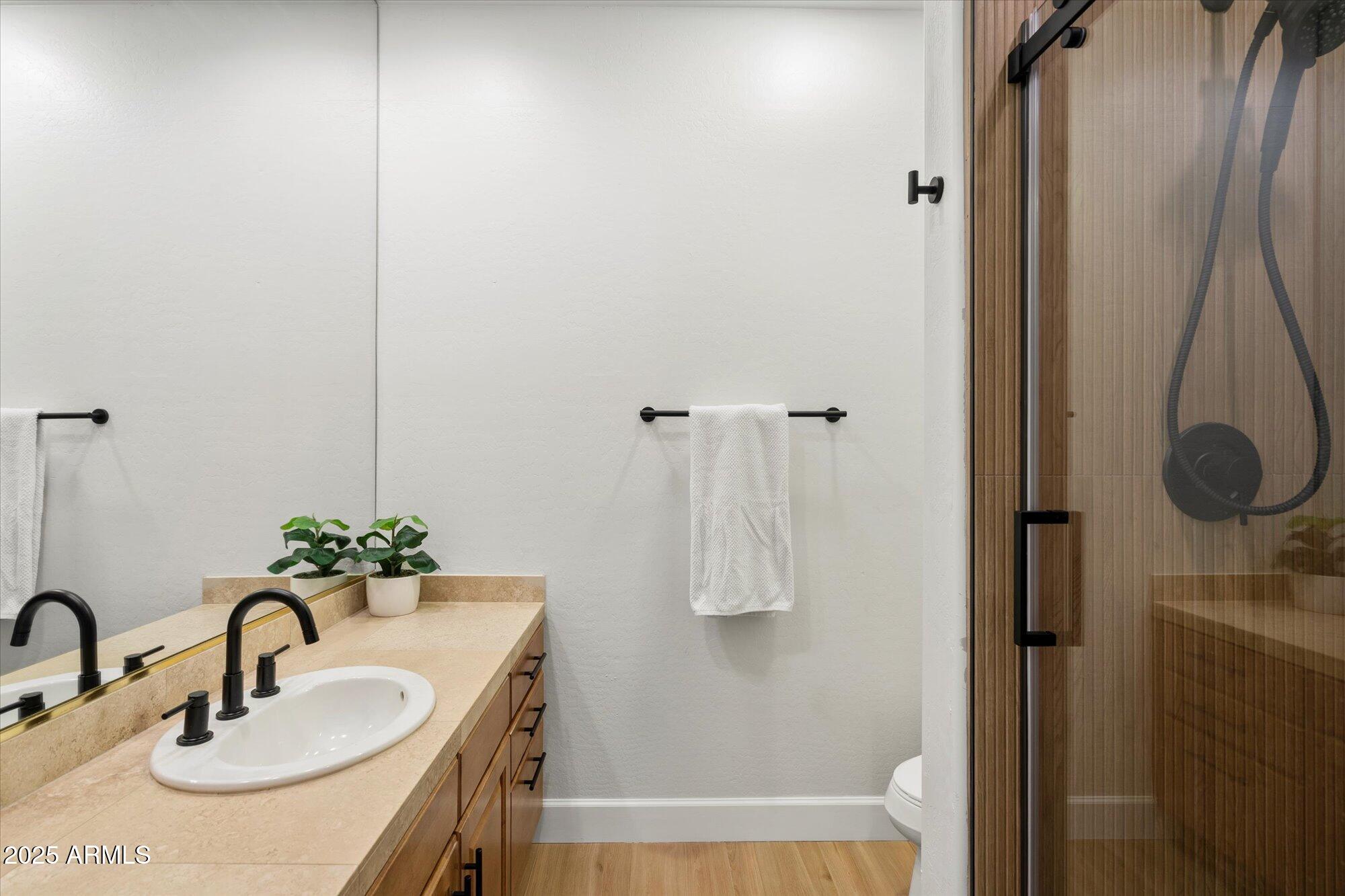 10747 East Greenway Road Scottsdale, AZ 85255 - Photo 26 of 56 a bathroom with a sink and a mirror