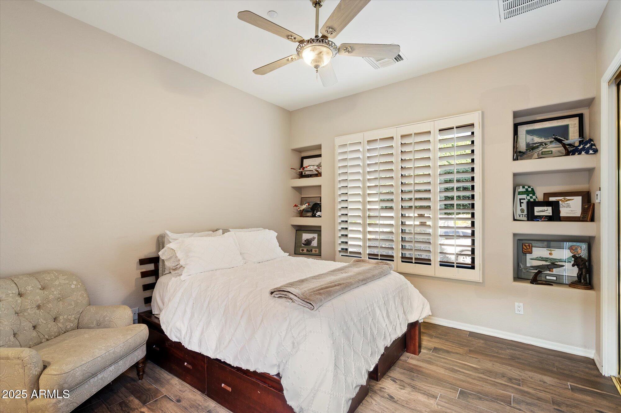 10747 East Greenway Road Scottsdale, AZ 85255 - Photo 28 of 56 a bedroom with a bed and a couch