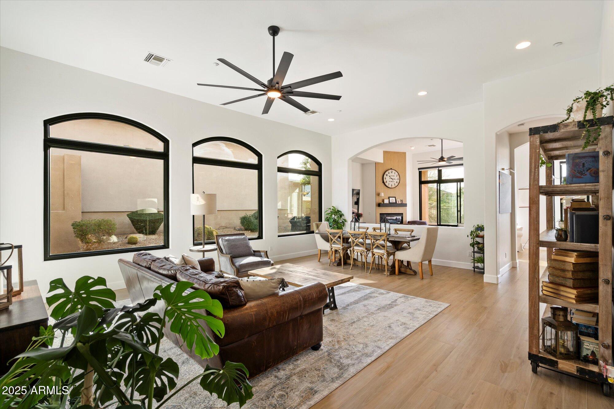 10747 East Greenway Road Scottsdale, AZ 85255 - Photo 3 of 56 a living room with furniture and a large window