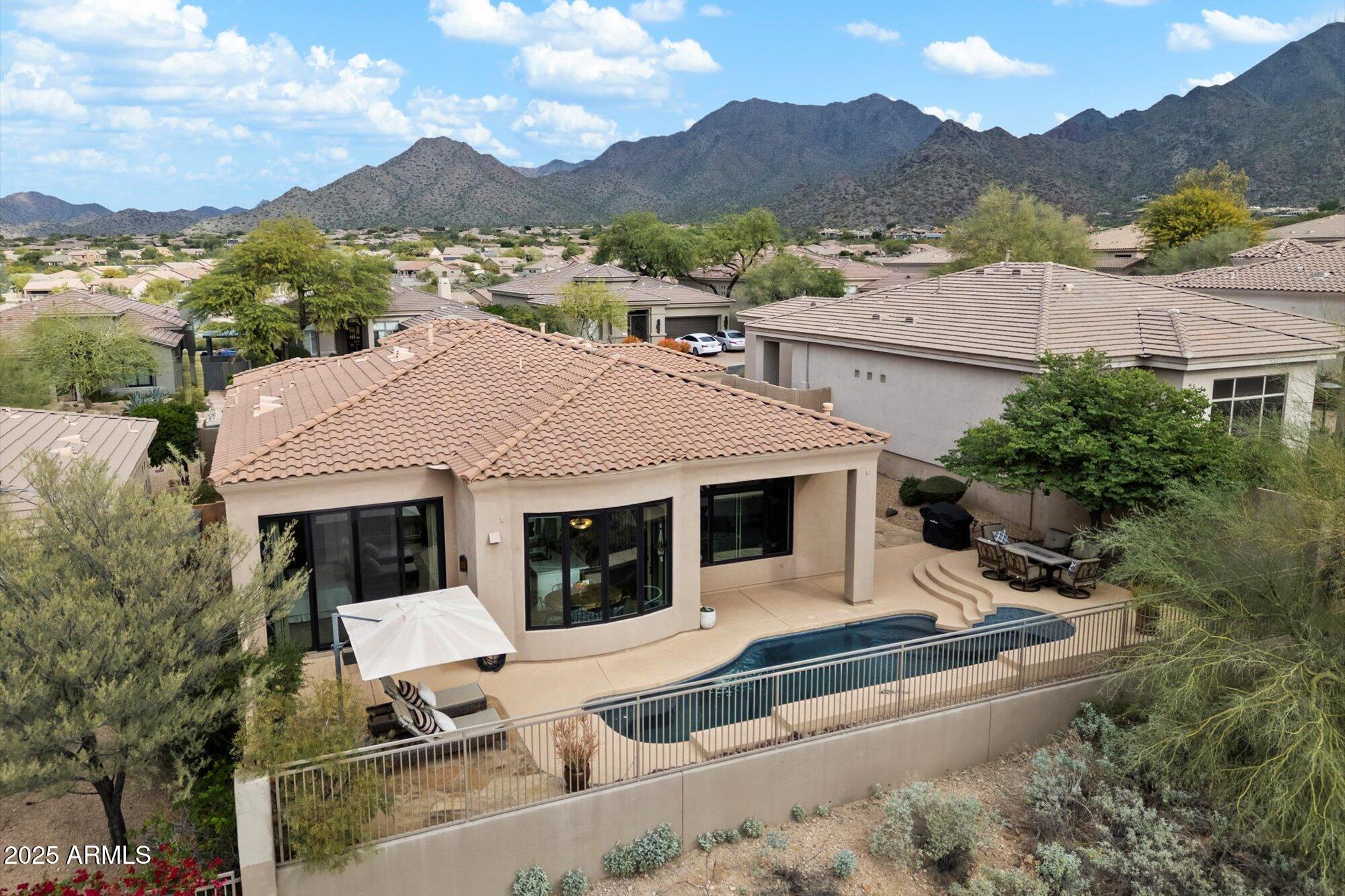 10747 East Greenway Road Scottsdale, AZ 85255 - Photo 5 of 56 an aerial view of a house with a yard and mountain view