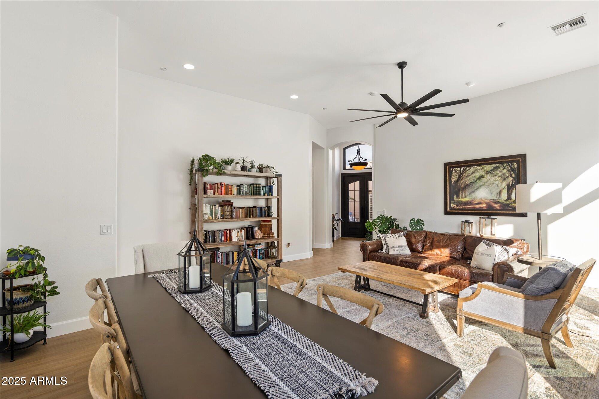 10747 East Greenway Road Scottsdale, AZ 85255 - Photo 9 of 56 a living room with furniture and wooden floor