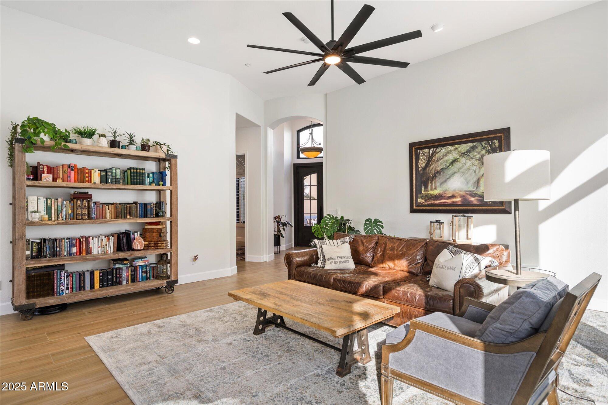 10747 East Greenway Road Scottsdale, AZ 85255 - Photo 10 of 56 a living room with furniture and a book shelf
