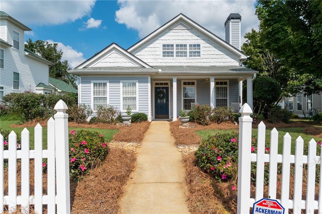 a front view of a house with garden