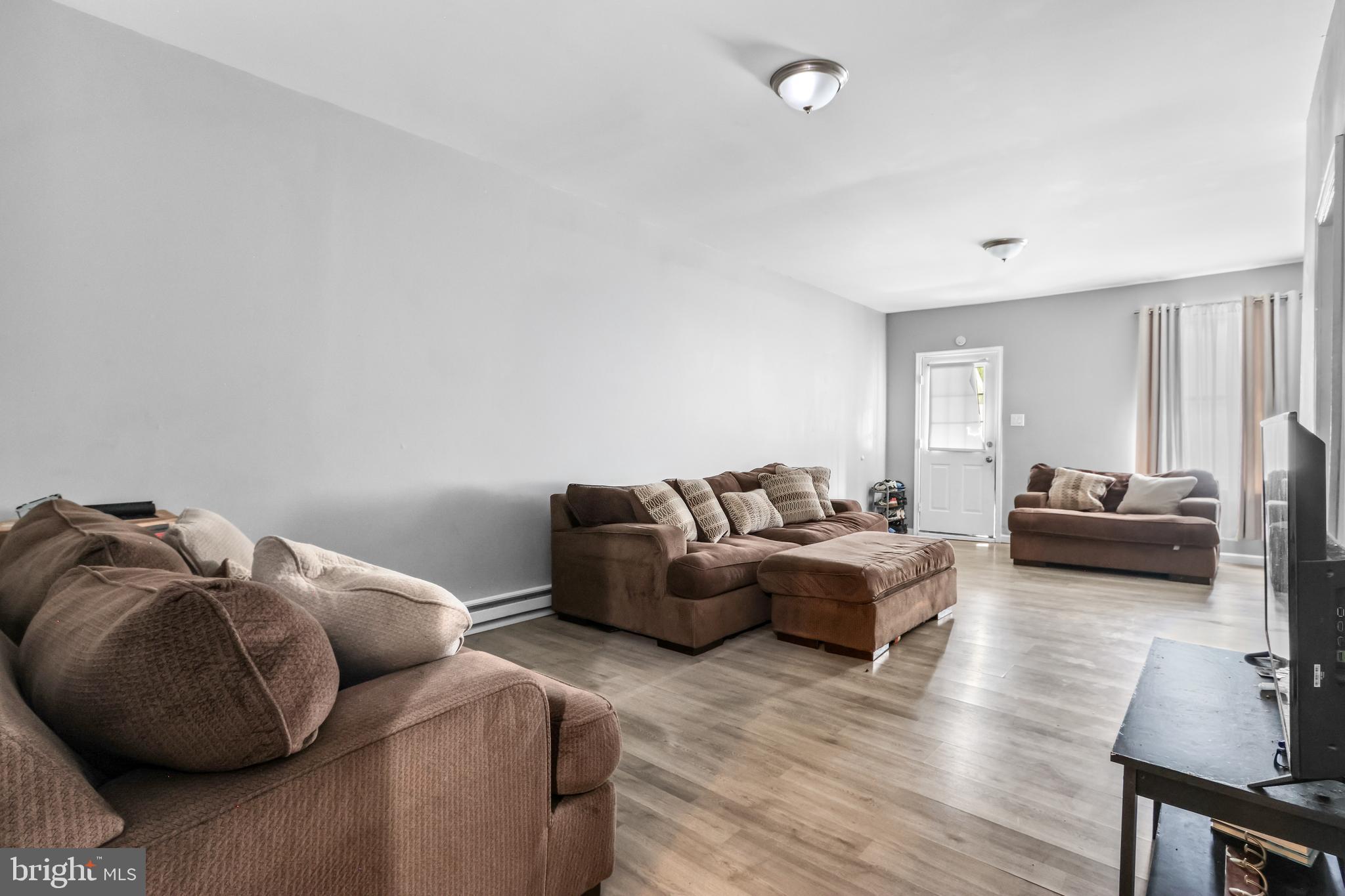 12 South Front Street Coplay, PA 18037 - Photo 21 of 42 a living room with furniture and a wooden floor