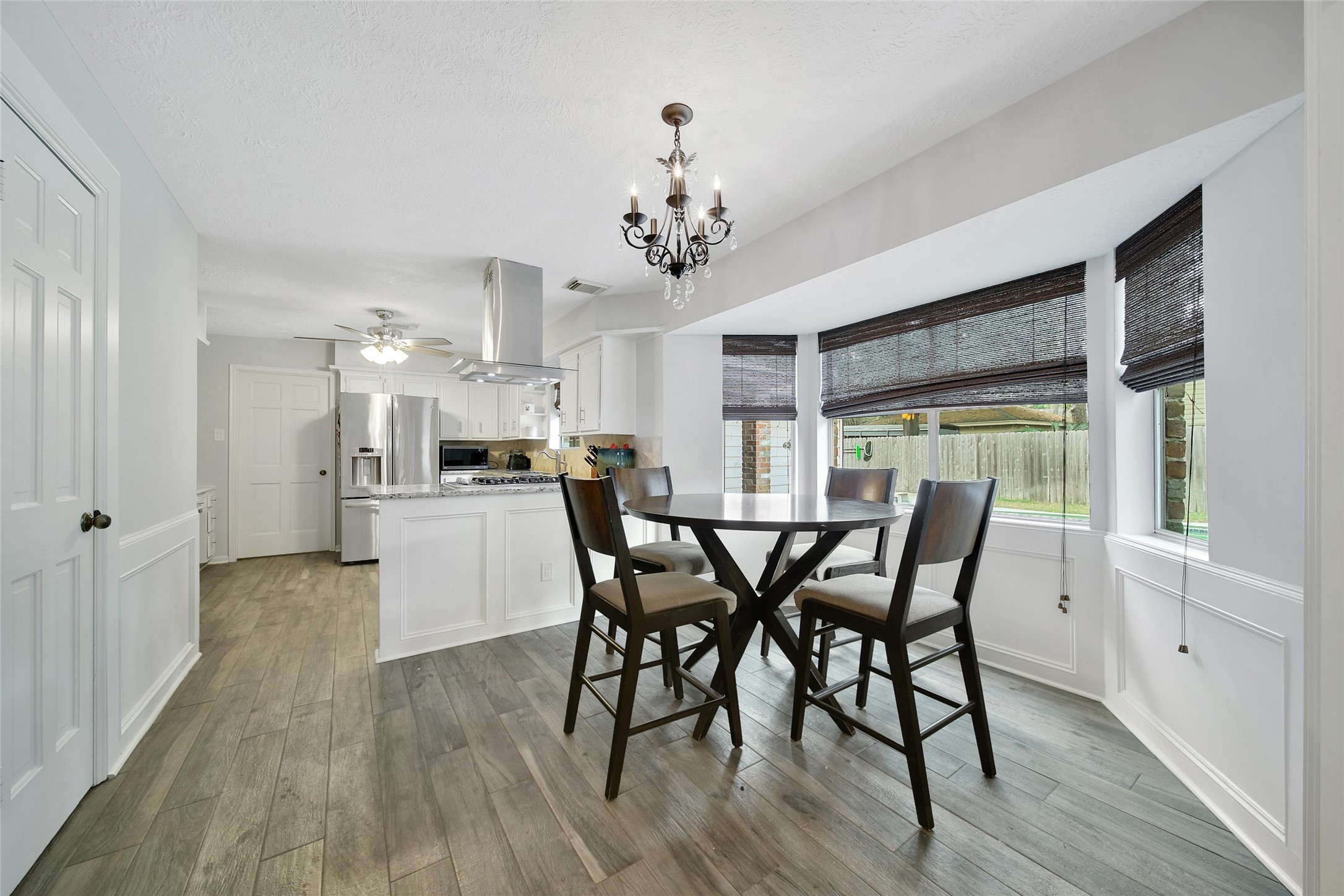 6522 Castle Pine Lane Spring, TX 77379 - Photo 11 of 38 a view of a dining room with furniture and wooden floor