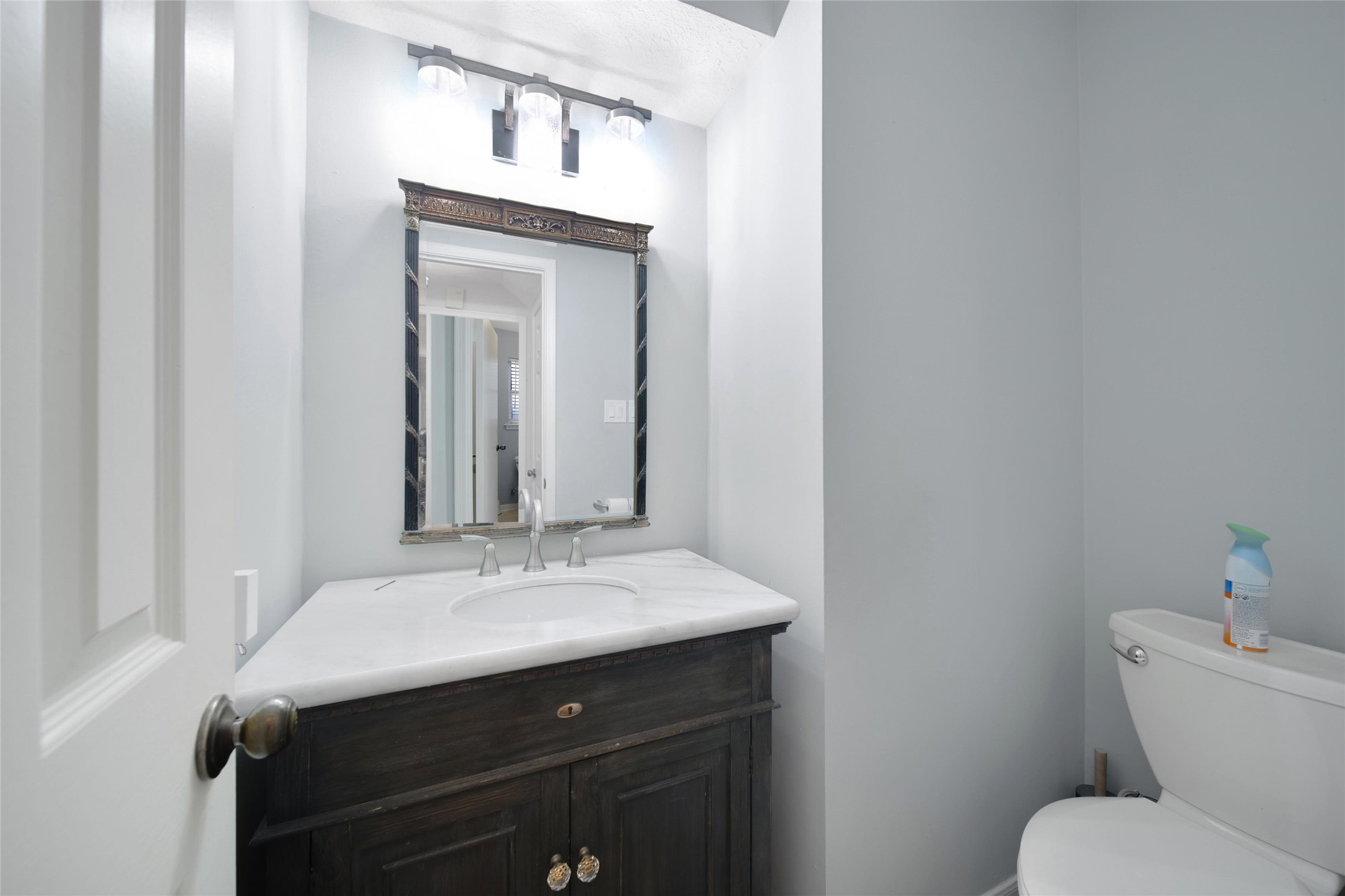 6522 Castle Pine Lane Spring, TX 77379 - Photo 19 of 38 a bathroom with a sink vanity mirror and toilet