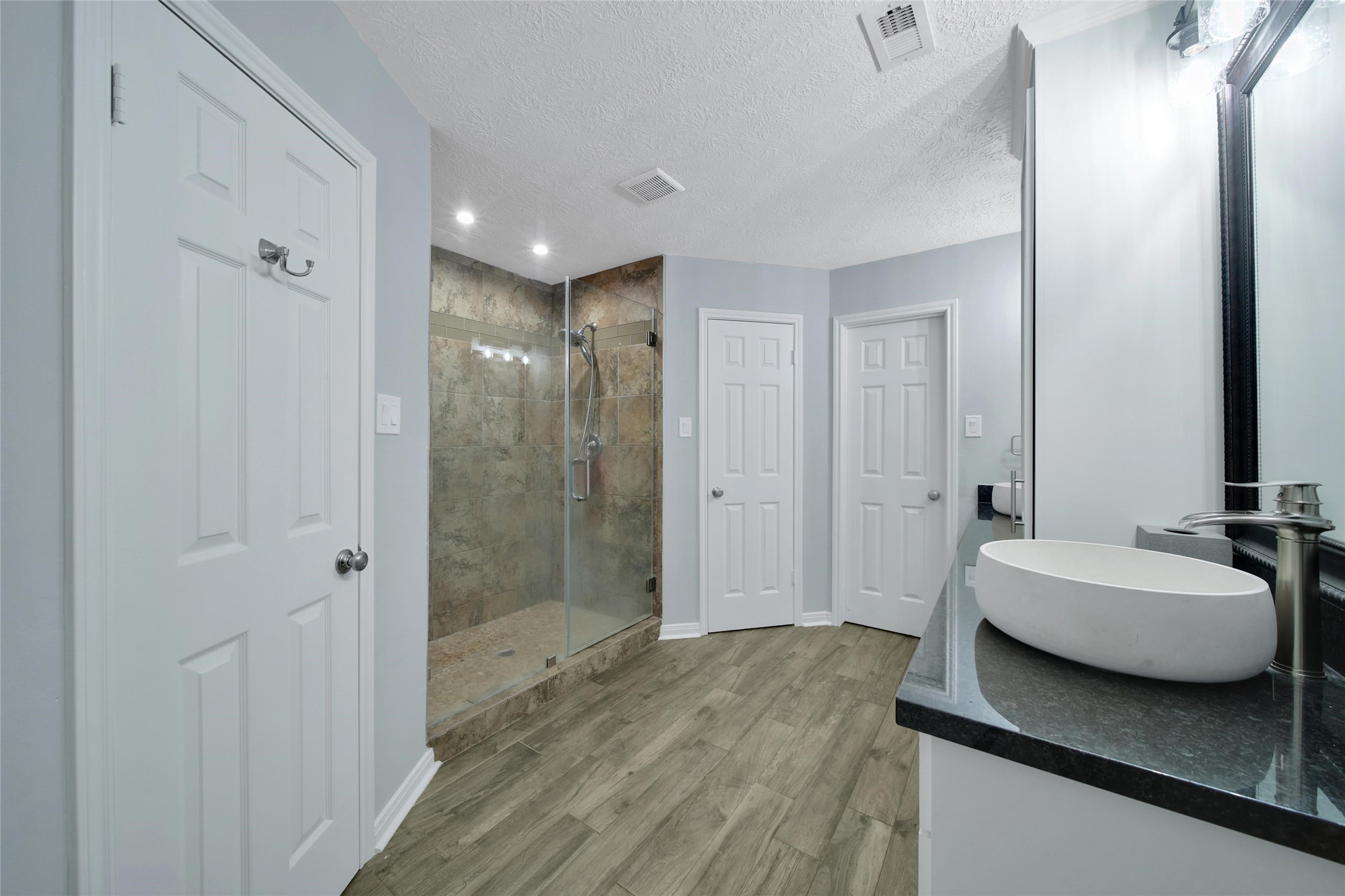 6522 Castle Pine Lane Spring, TX 77379 - Photo 23 of 38 a bedroom with a sink and a mirror