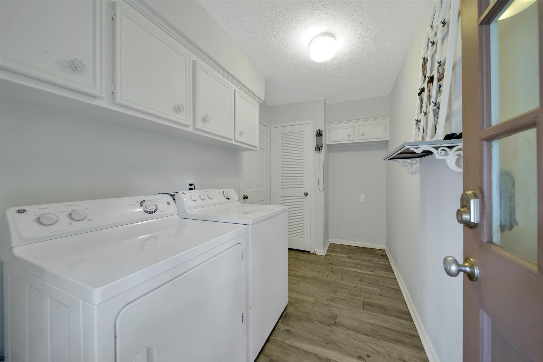 6522 Castle Pine Lane Spring, TX 77379 - Photo 26 of 38 a view of a hallway with washer and dryer