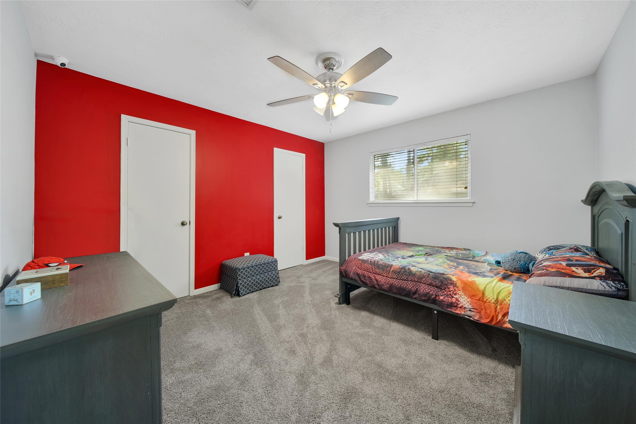 6522 Castle Pine Lane Spring, TX 77379 - Photo 30 of 38 a bedroom with a bed and a chandelier