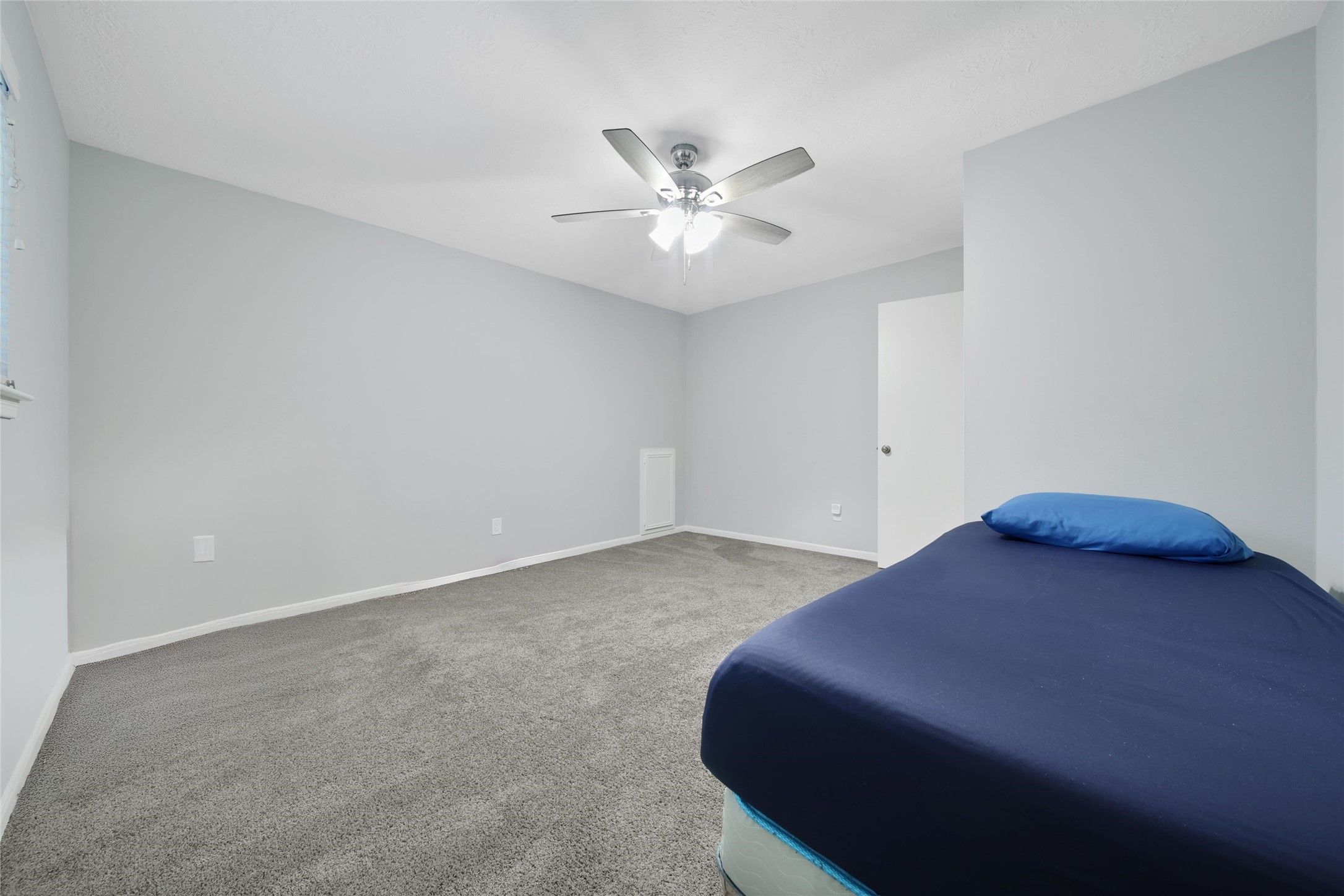 6522 Castle Pine Lane Spring, TX 77379 - Photo 31 of 38 a bedroom with a bed and a ceiling fan